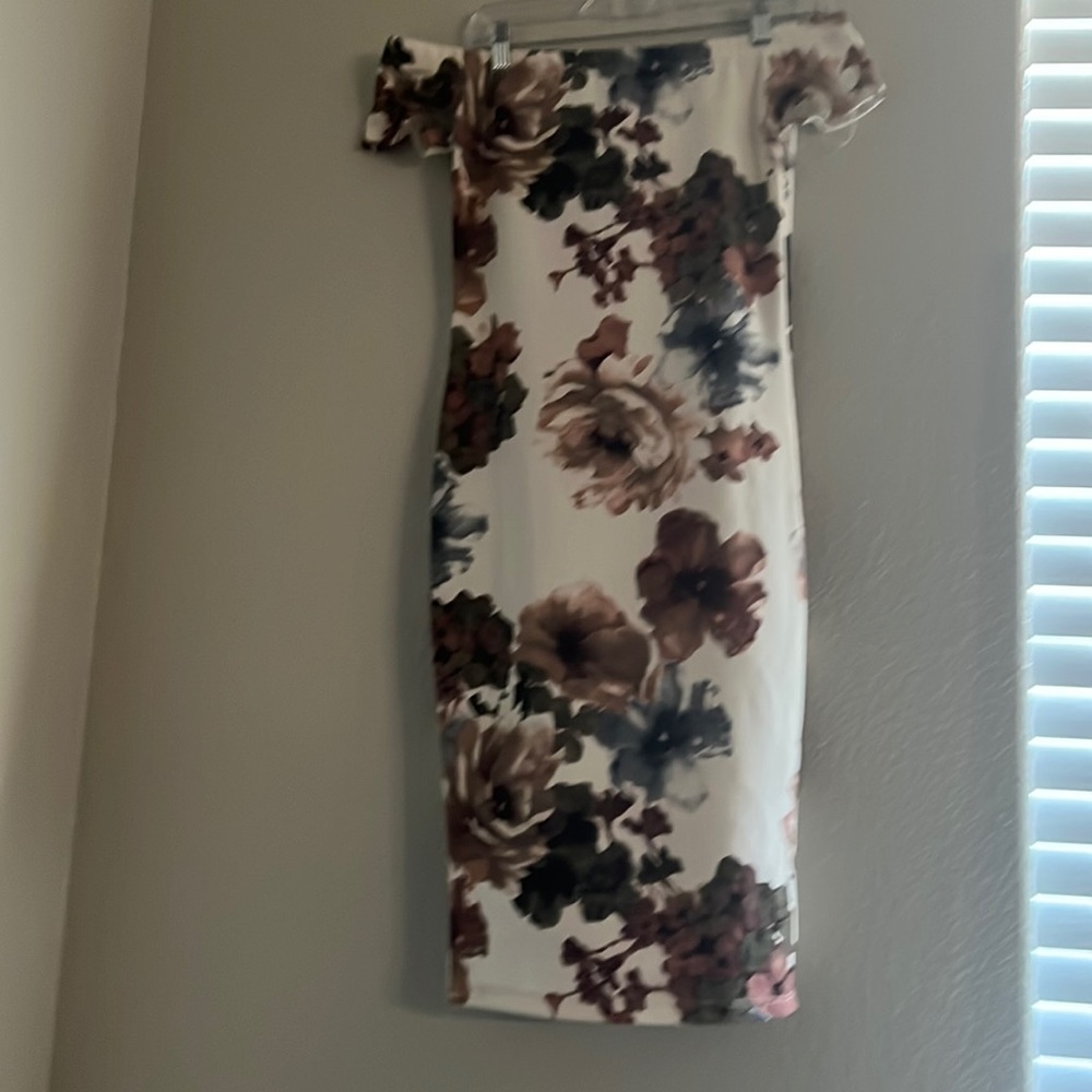A white formal dress with flowers.